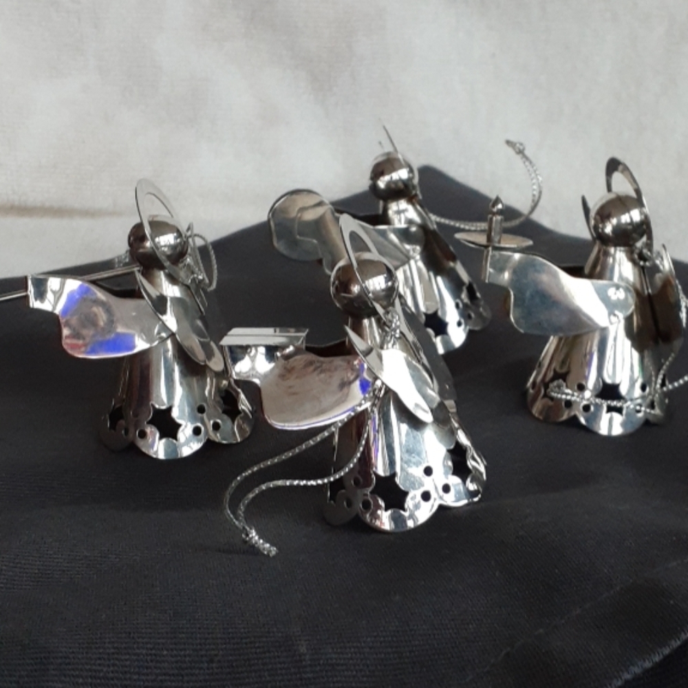 4 metal angel ornaments made in China.